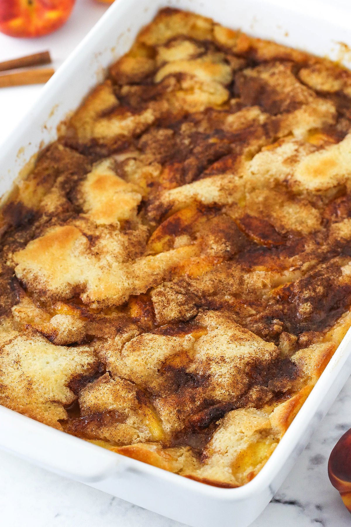 Baked Peach Cobbler in white dish