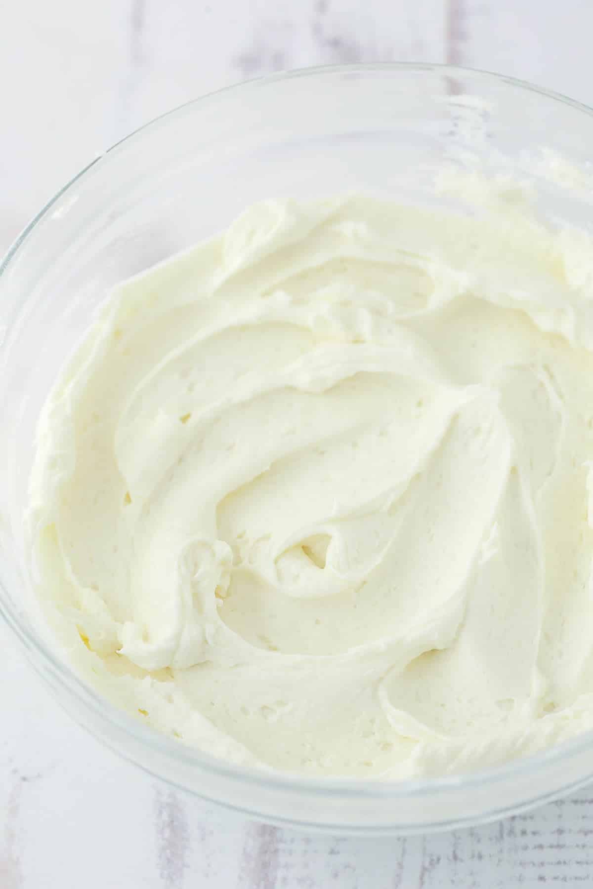 ermine frosting in glass bowl on white background