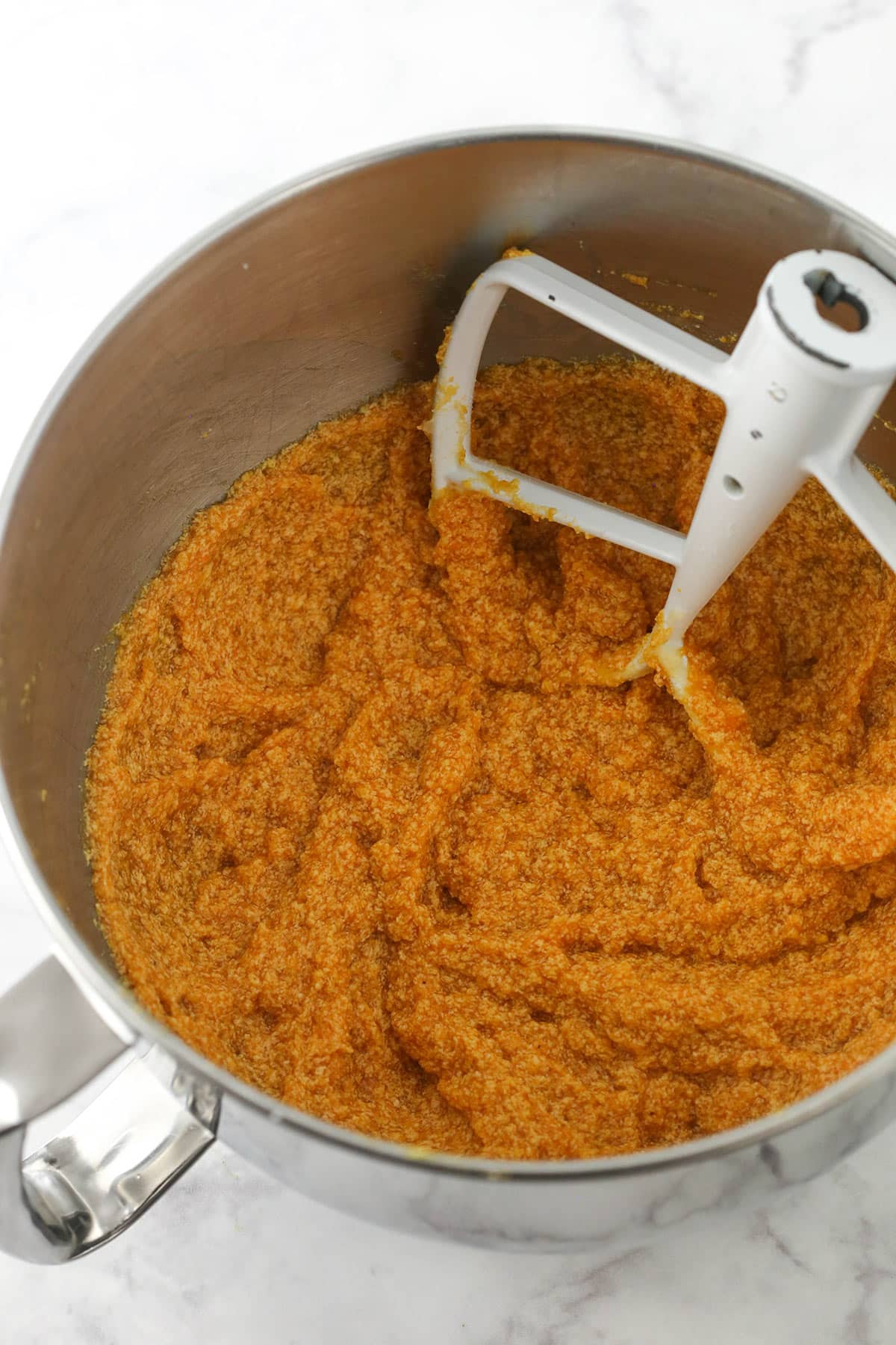 The wet ingredients in a bowl after the pumpkin puree has been added