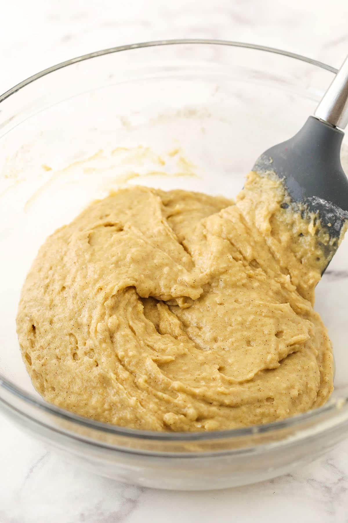 The muffin batter in a big mixing bowl before the apples have been folded in