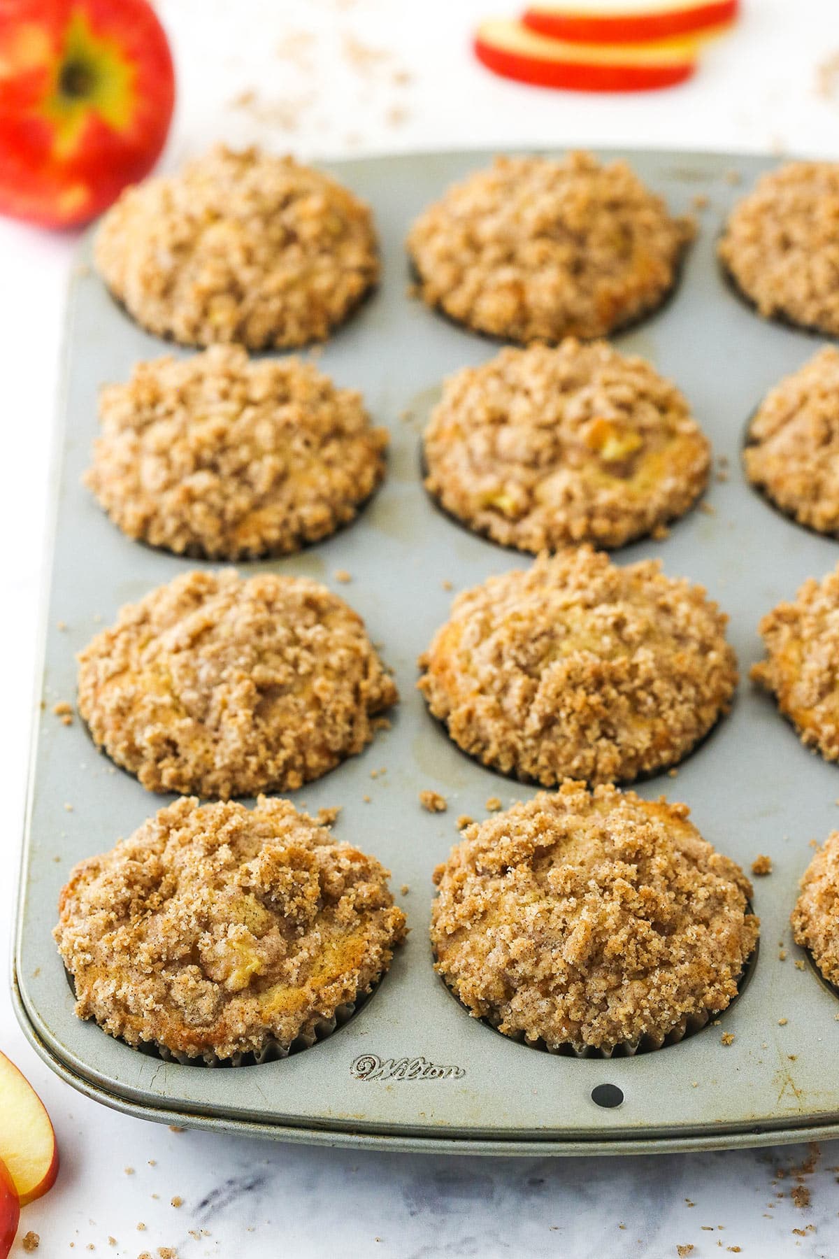 baked apple muffins in muffin pan