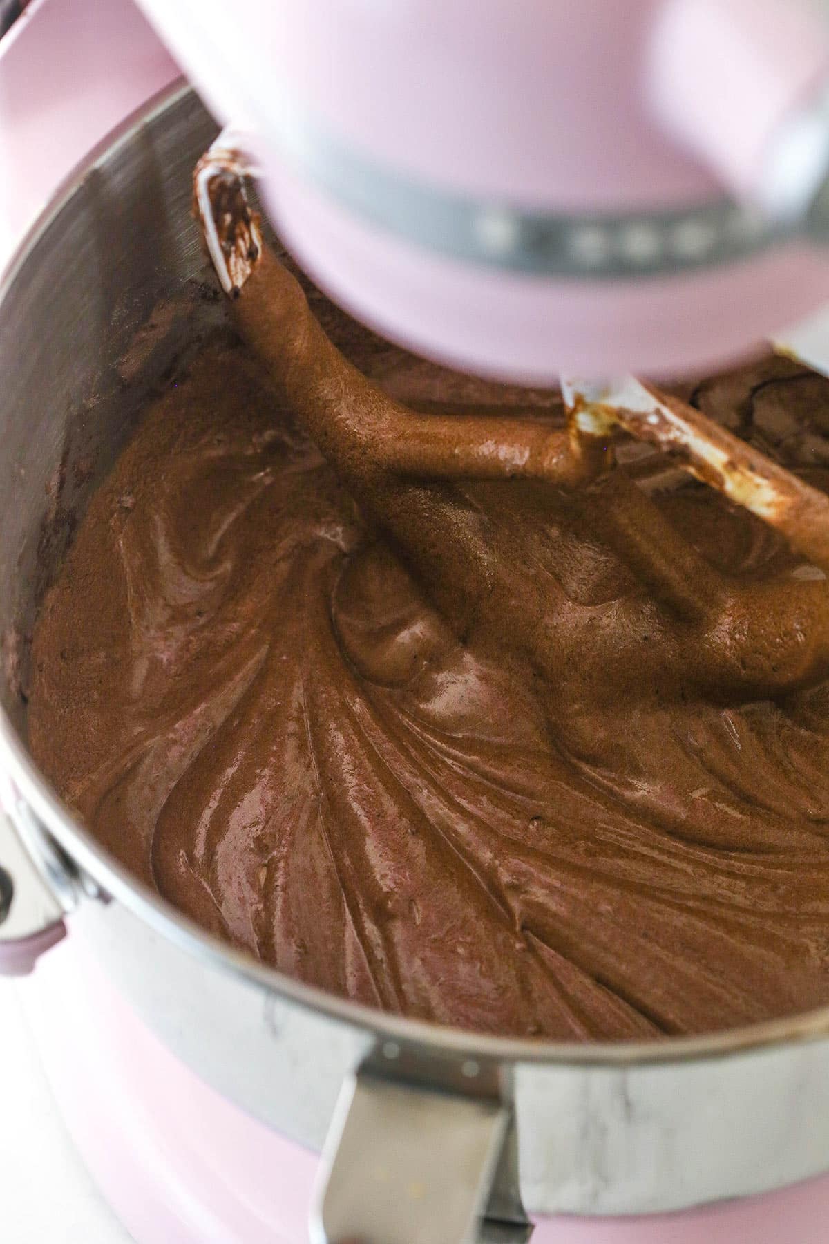 devils food cake batter in mixing bowl on stand mixer