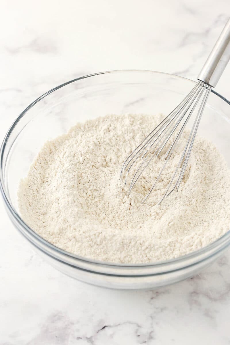 The dry ingredients being whisked together in a medium-sized mixing bowl.