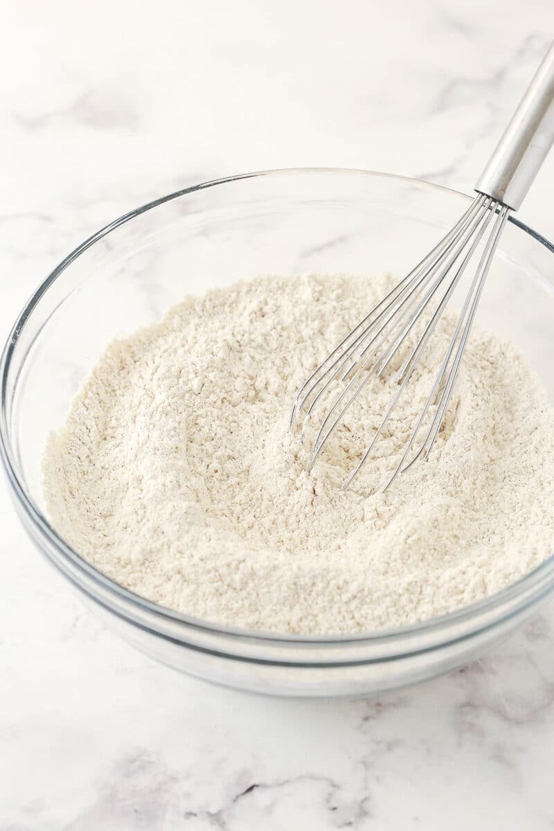 The dry ingredients being whisked together in a medium-sized mixing bowl.