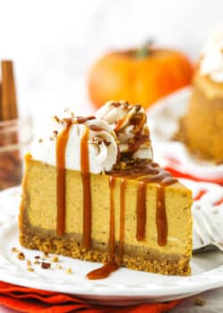 A slice of pumpkin cheesecake topped with a drizzle of homemade caramel sauce