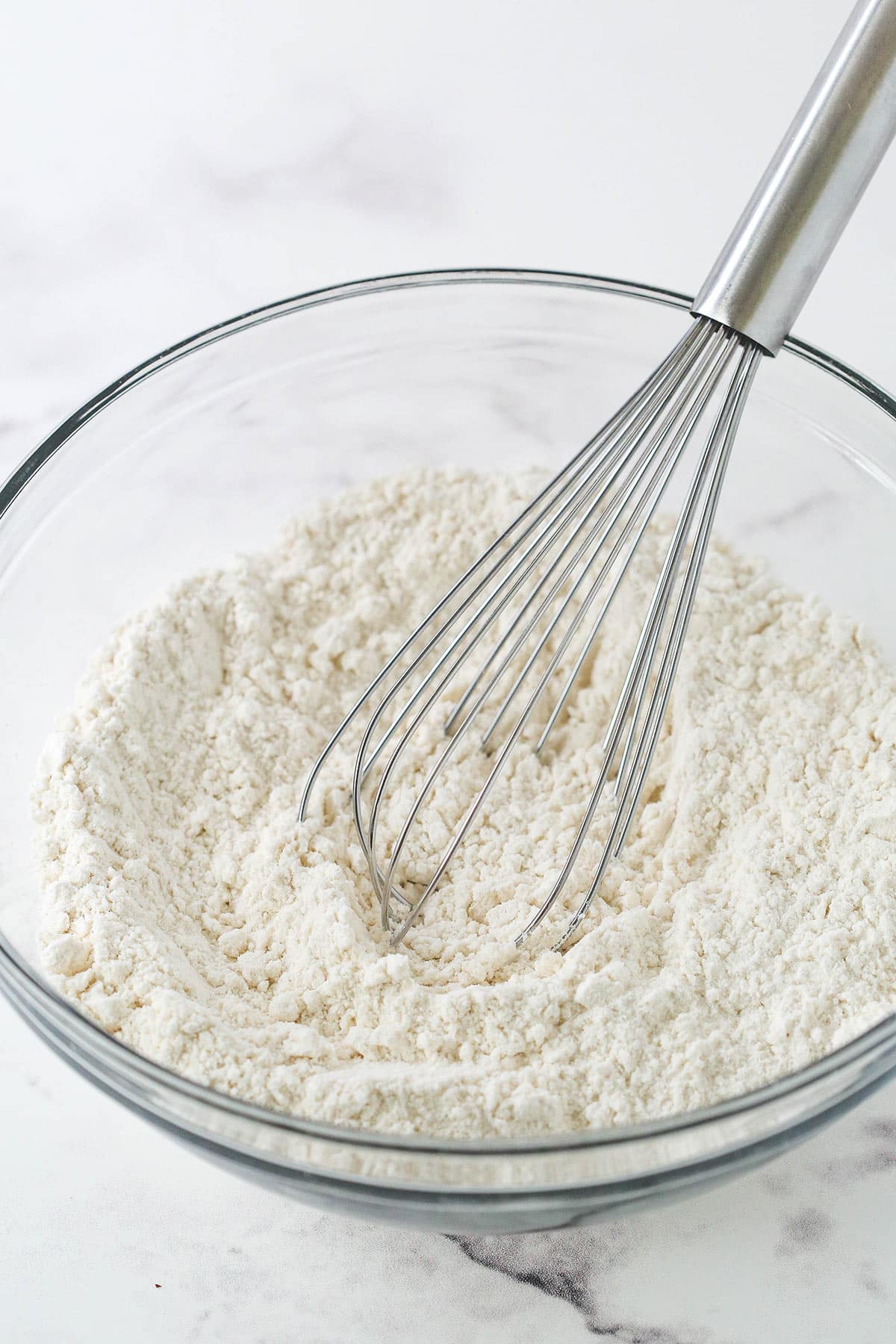 Combing dry ingredients in a glass bowl