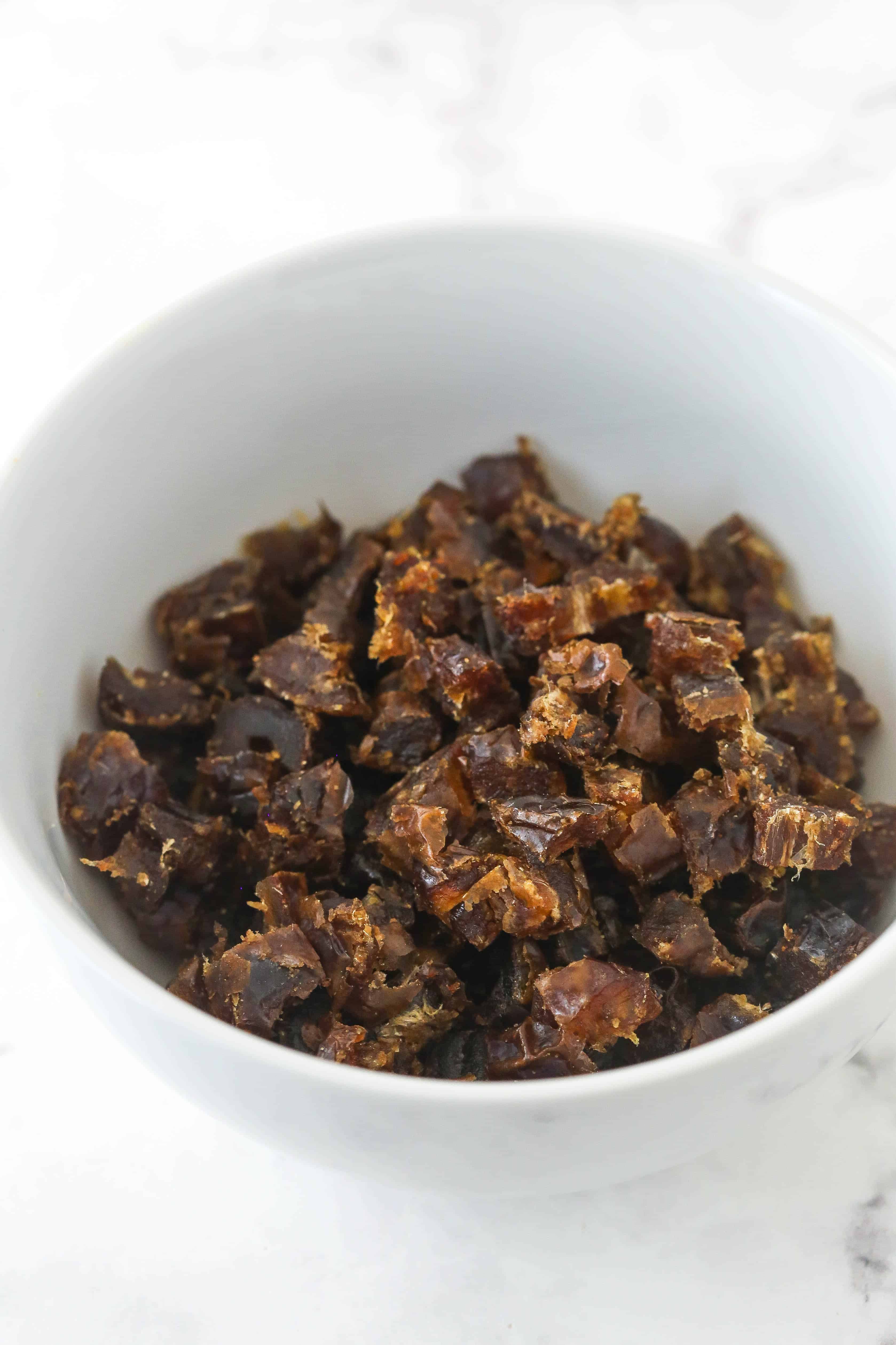 Chopped dates in a white bowl