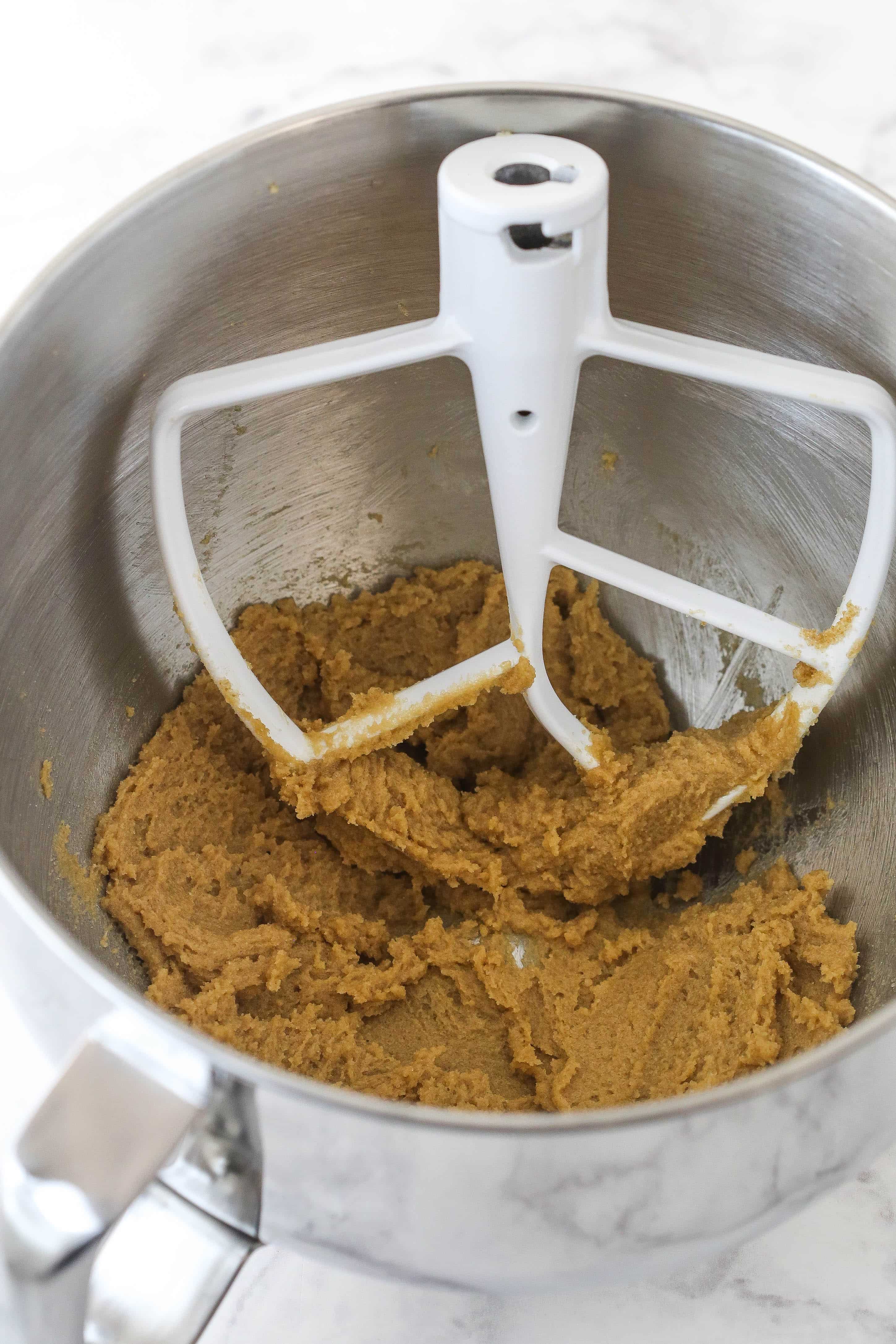 Creaming butter and sugar in a mixing bowl.