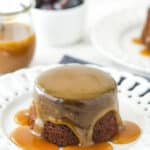 Sticky toffee pudding on a white serving plate