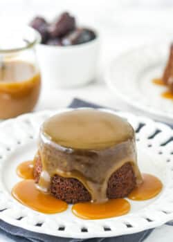 Sticky toffee pudding on a white serving plate