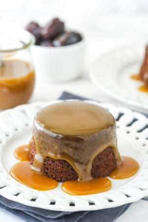 Sticky toffee pudding on a white serving plate