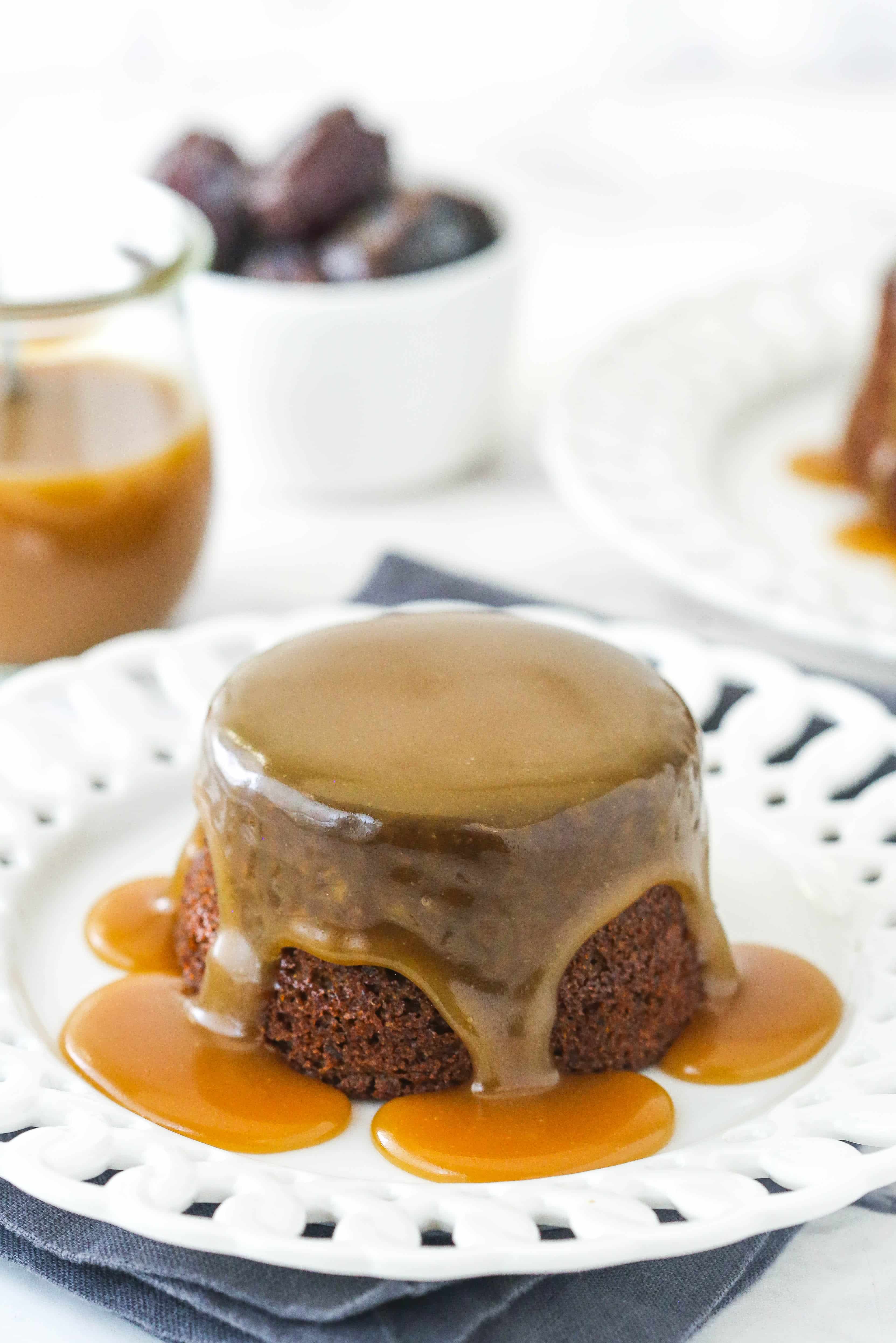 Sticky toffee pudding on a white serving plate