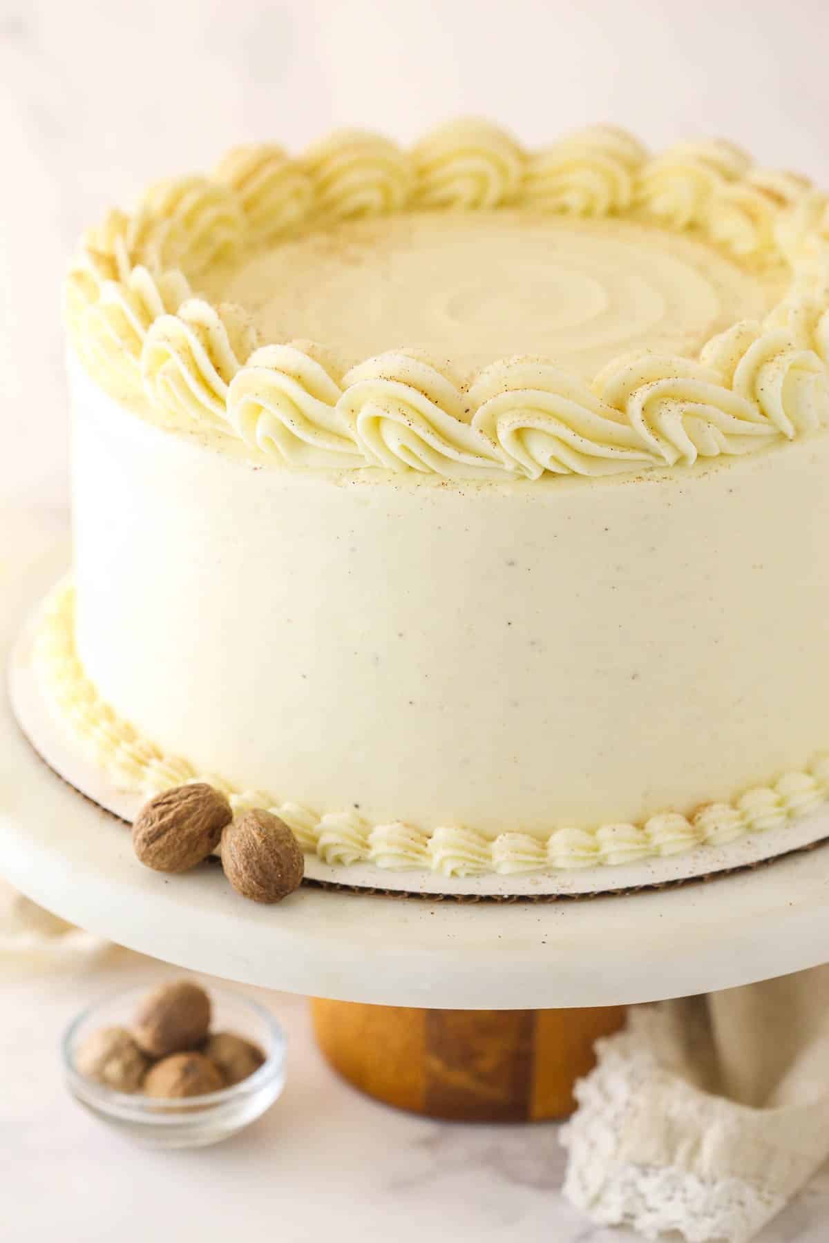 Close up of eggnog cake on a cake stand