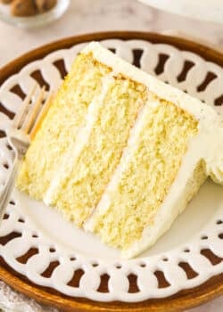 A slice of eggnog cake on a white serving plate