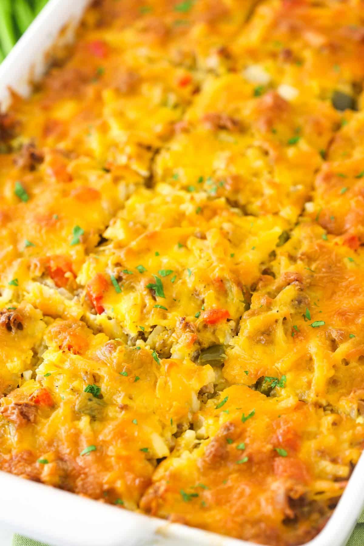 This Hashbrown Breakfast Casserole is perfect when you need to feed a crowd in the morning. Perfect for Christmas, Thanksgiving, or brunch! Hashbrown breakfast casserole cut into squares