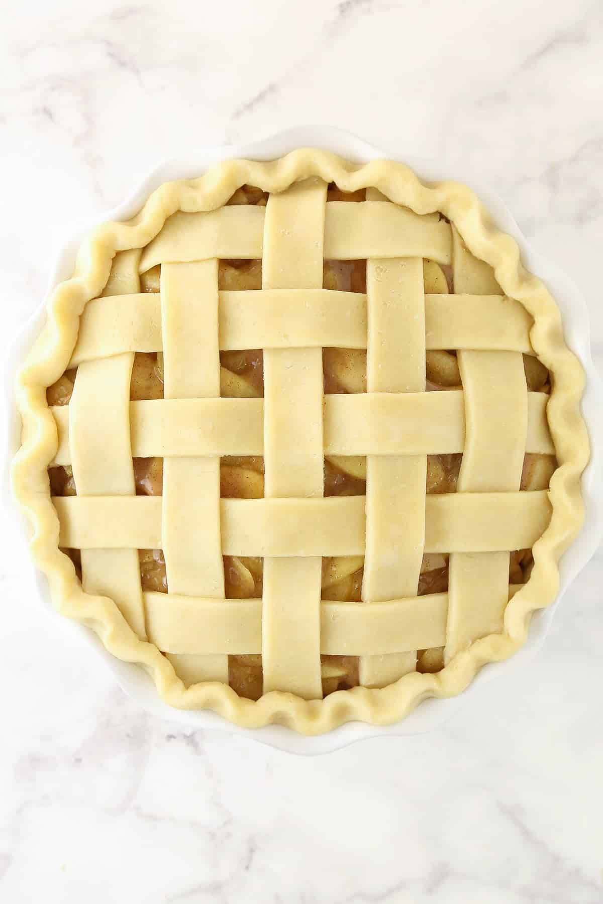 Fully assembled apple pie with a lattice crust.