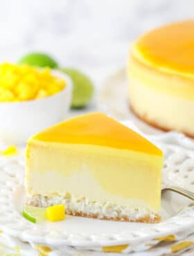 slice of mango key lime cheesecake on white plate