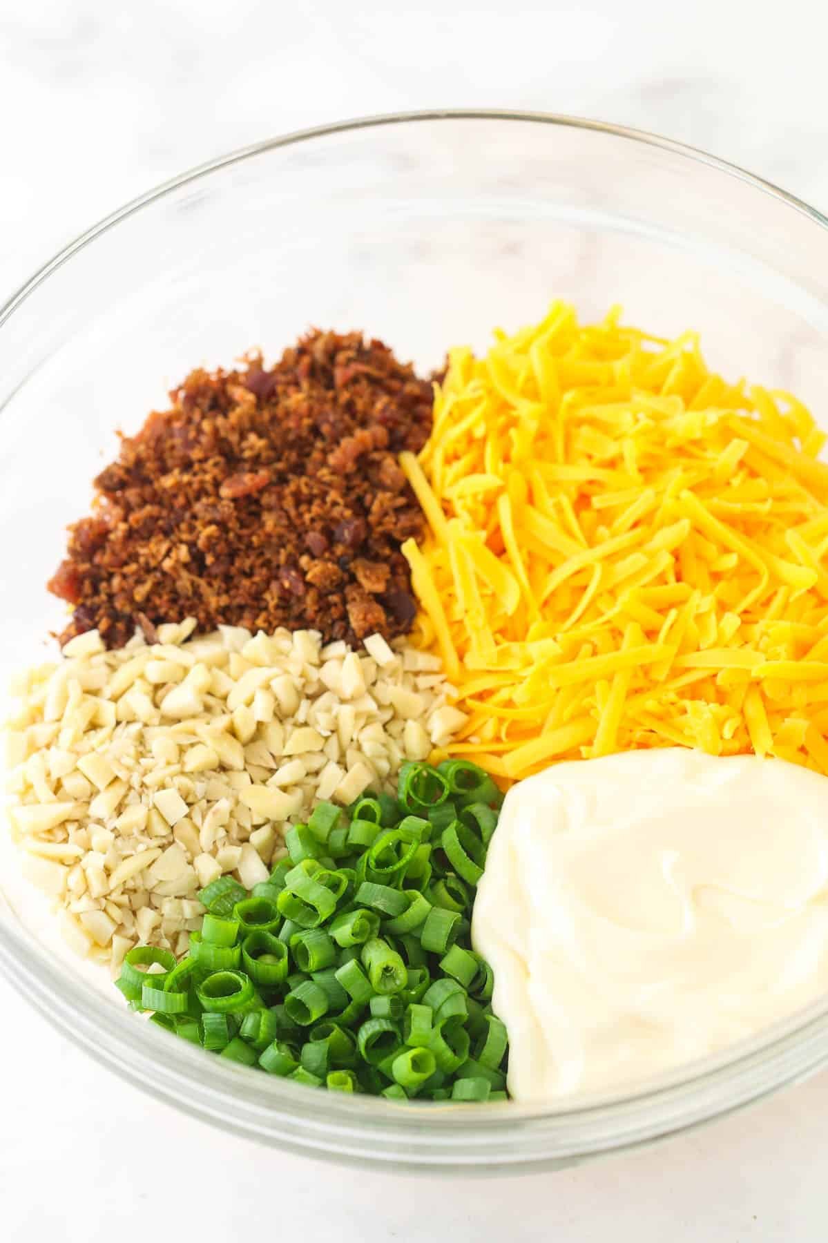 Million Dollar Dip is quick and made with only 5 ingredients - bacon, cheese, green onions, almonds, and mayo. A perfect game day snack! Ingredients for Million Dollar Dip
