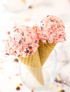 Two scoops of peppermint bark ice cream on cones