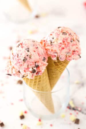 Two scoops of peppermint bark ice cream on cones