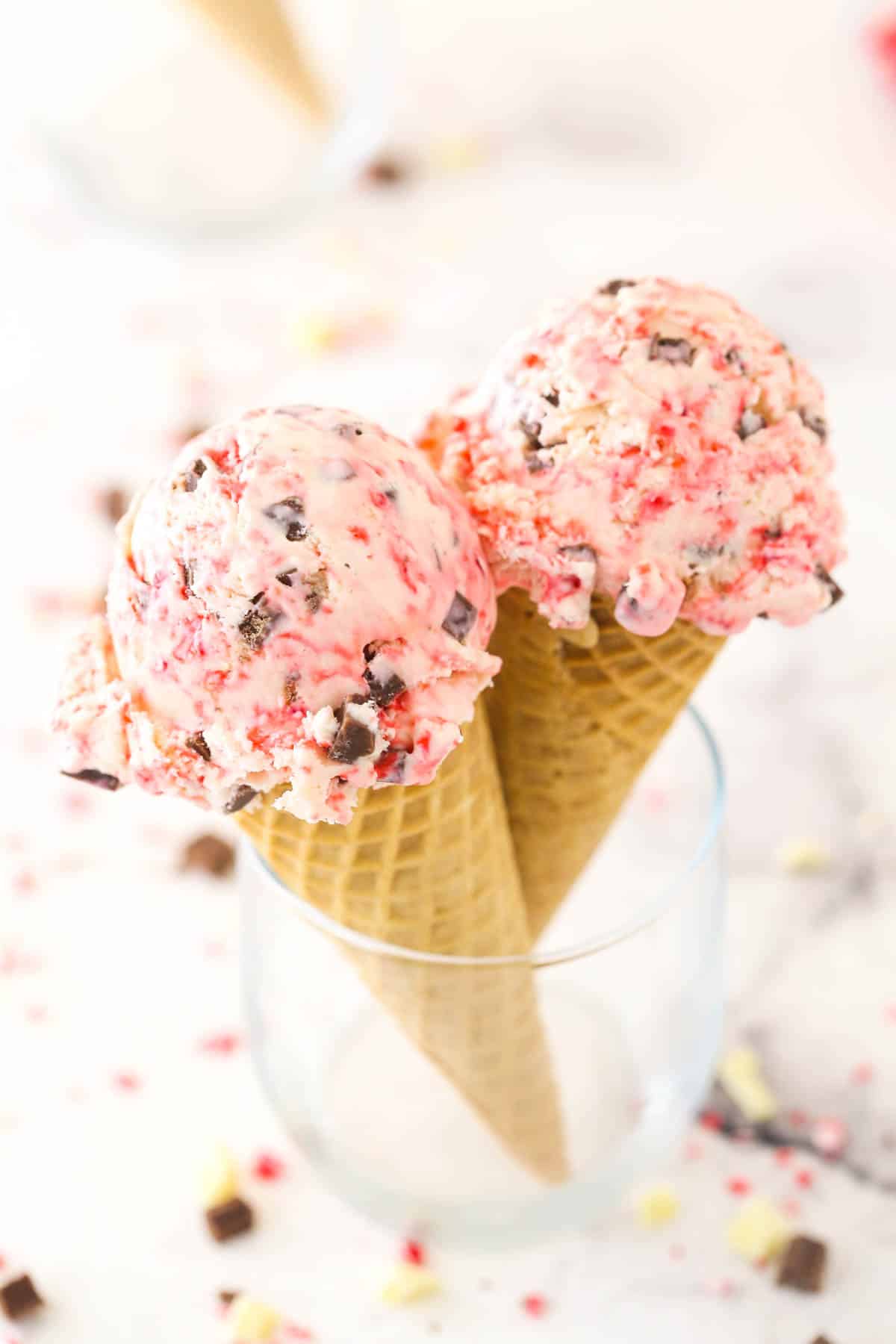 Two scoops of peppermint bark ice cream on cones