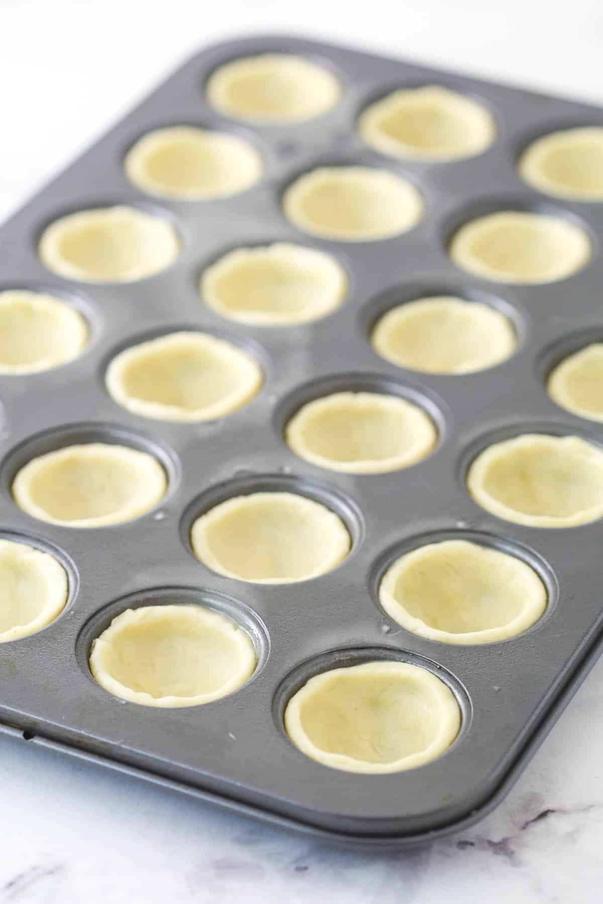 Fitting the crust into 24 mini muffin cups