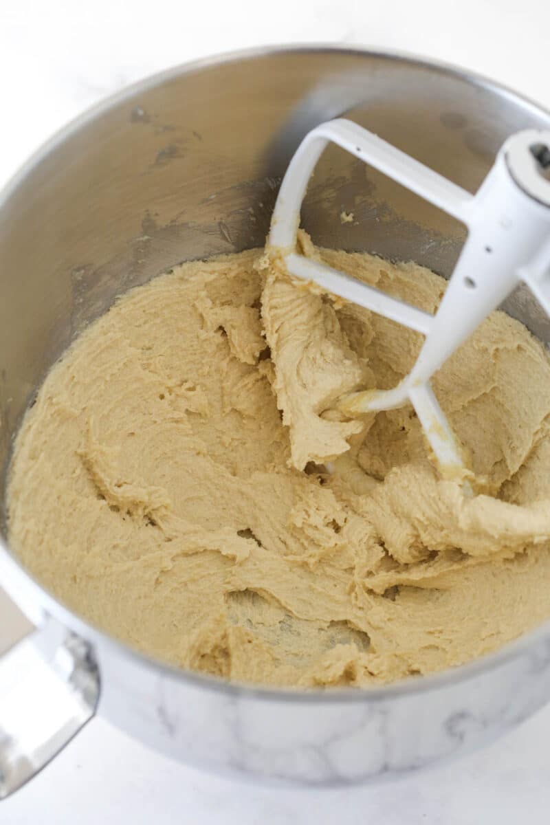 Creaming the butter and sugar in a mixing bowl.