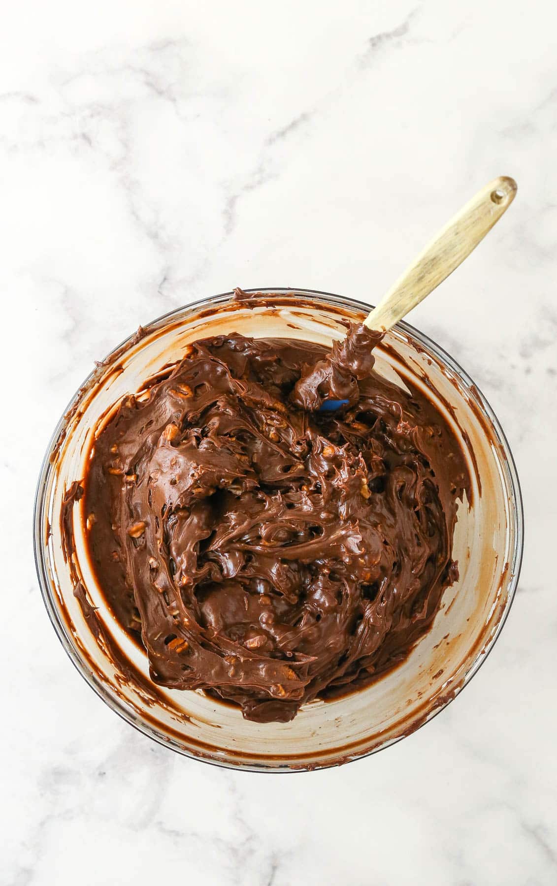 Adding the nuts to the melted chocolate