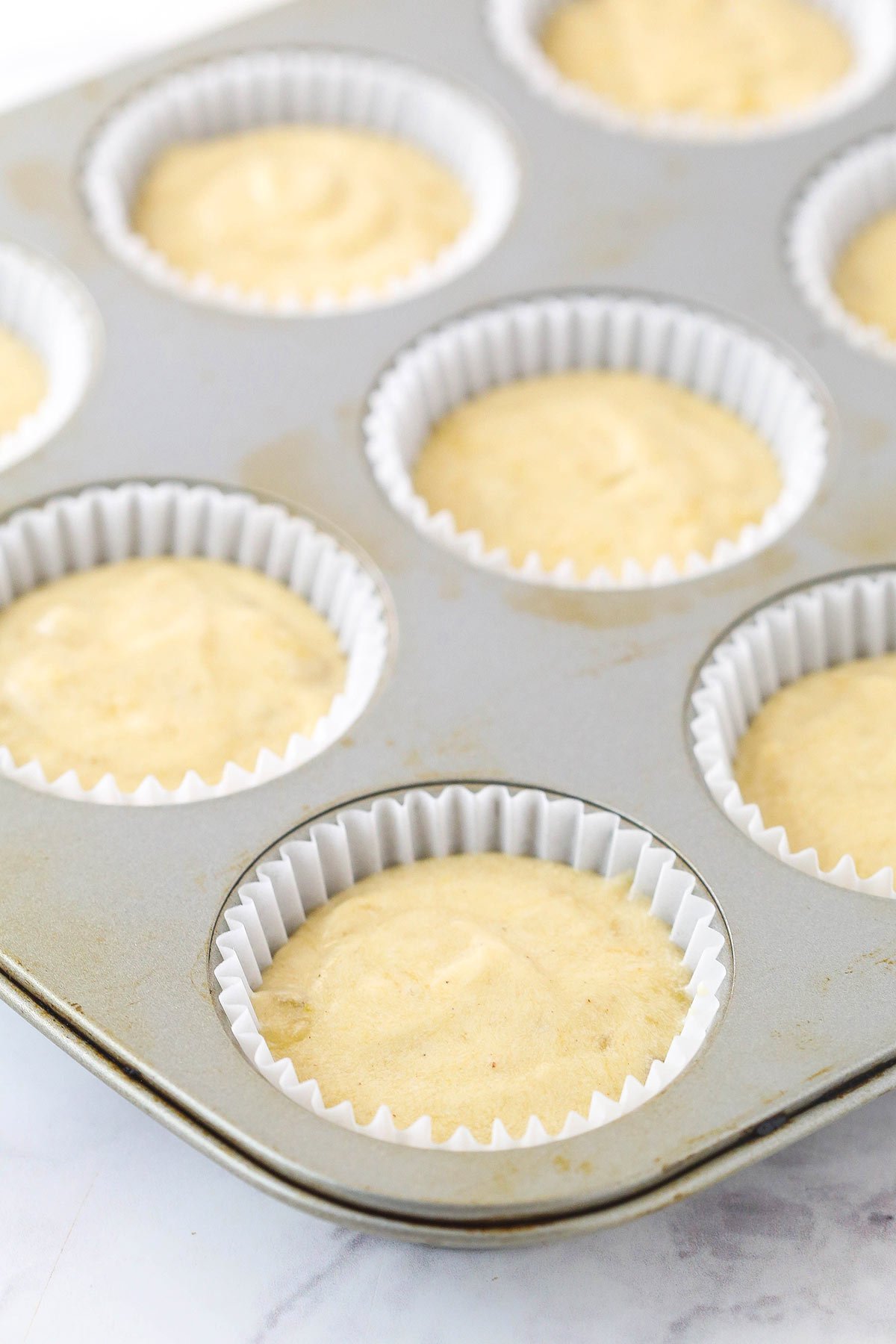 Filled cupcake liners with batter.