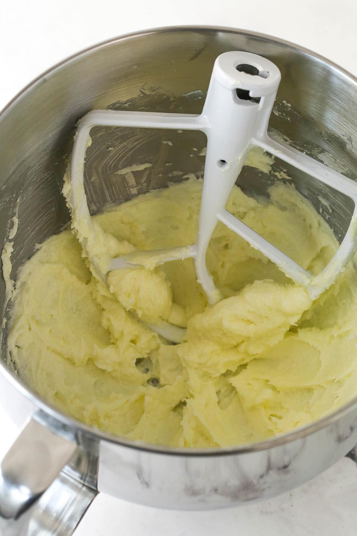 Butter and sugar creamed together in a mixer bowl.