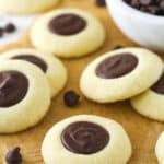 chocolate thumbprint cookies on brown parchment paper