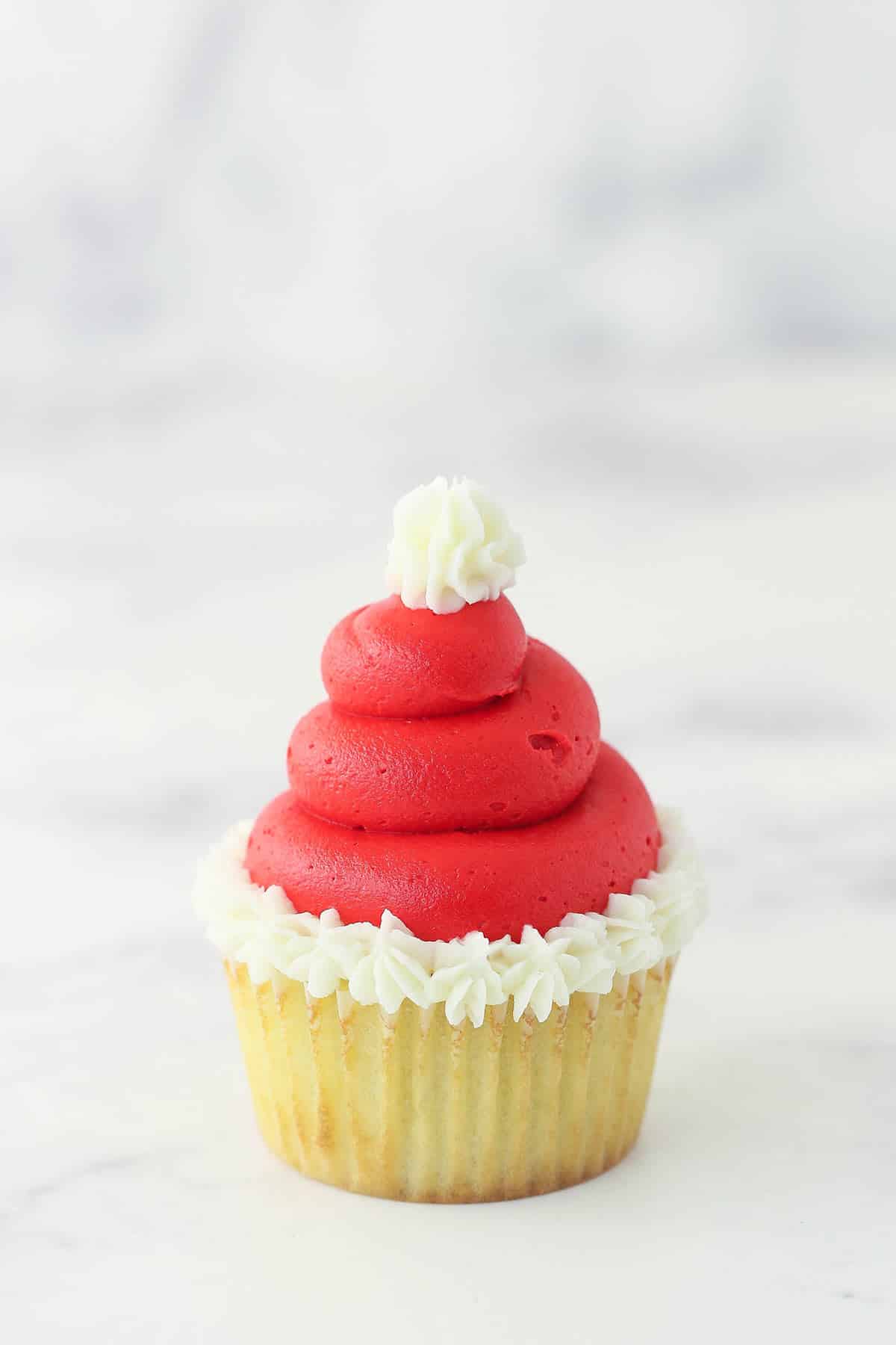 finished santa hat cupcake on marble background