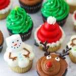 finished decorated christmas cupcakes on marble background