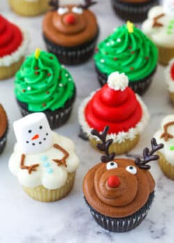 finished decorated christmas cupcakes on marble background