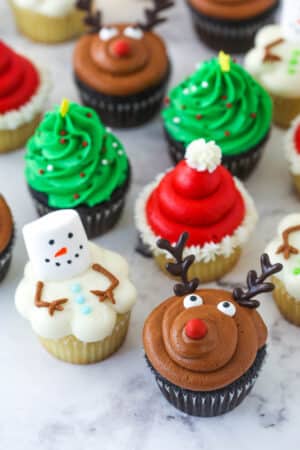 finished decorated christmas cupcakes on marble background