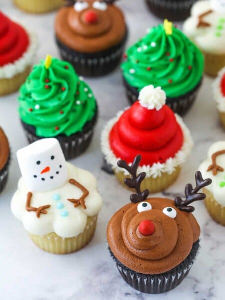 finished decorated christmas cupcakes on marble background