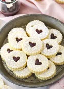 Linzer tart cookies on a plate.