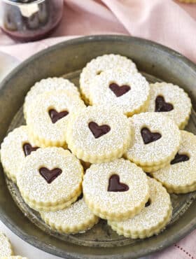 Linzer tart cookies on a plate.