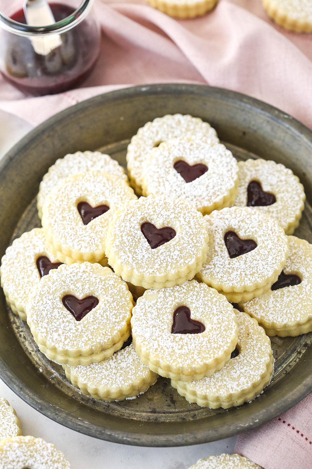 Linzer tart cookies on a plate.