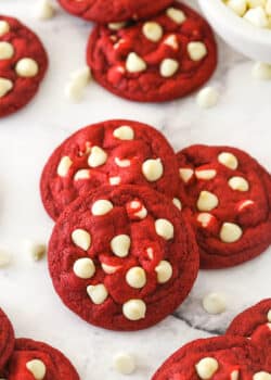 Small stack of red velvet cookies with white chocolate chips.