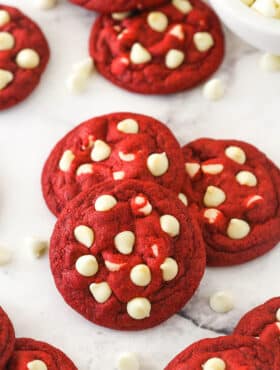 Small stack of red velvet cookies with white chocolate chips.