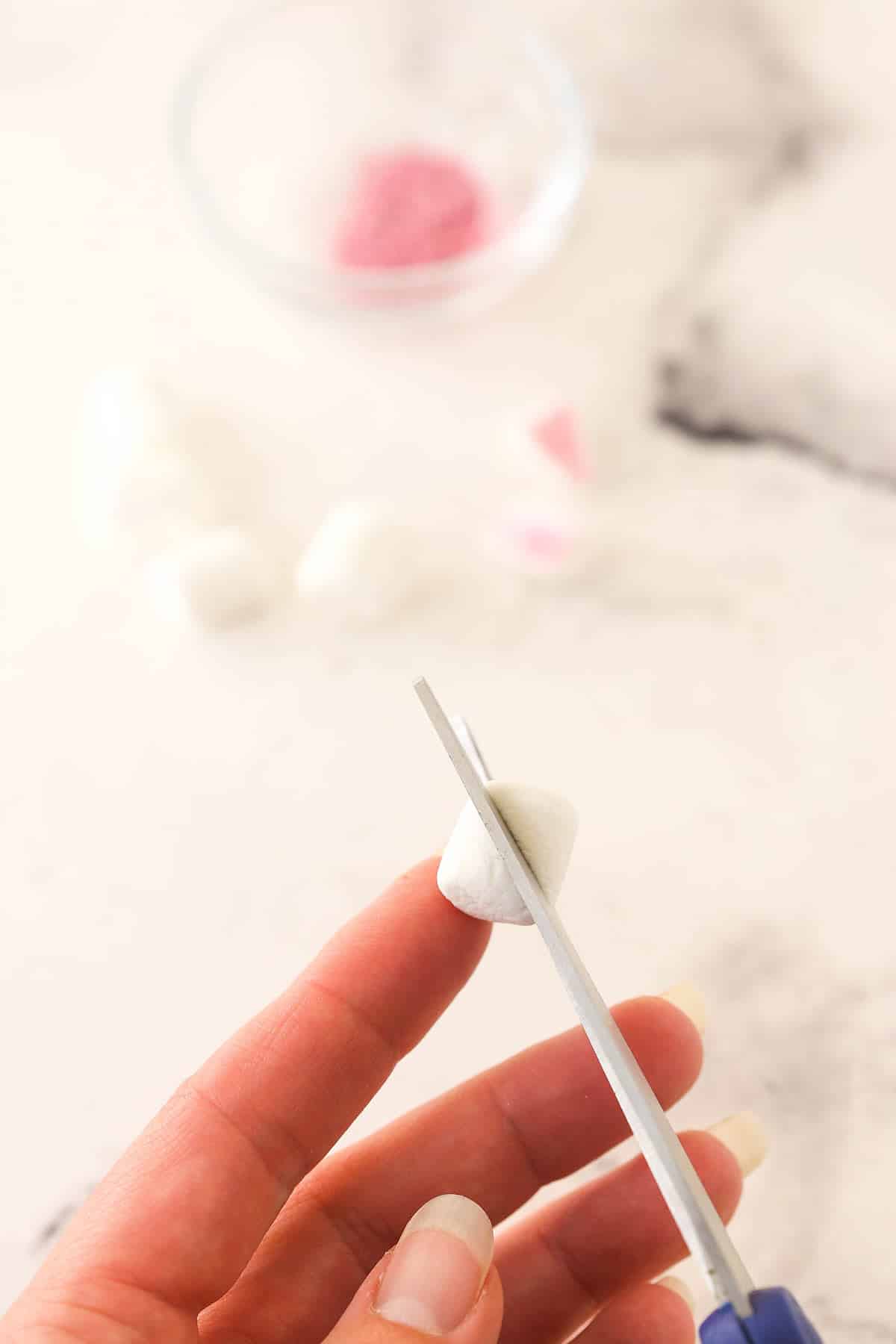 Cutting a marshmallow diagonally.