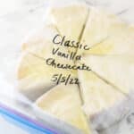 individually wrapped slices of cheesecake in a ziplock bag with the name and date written on it