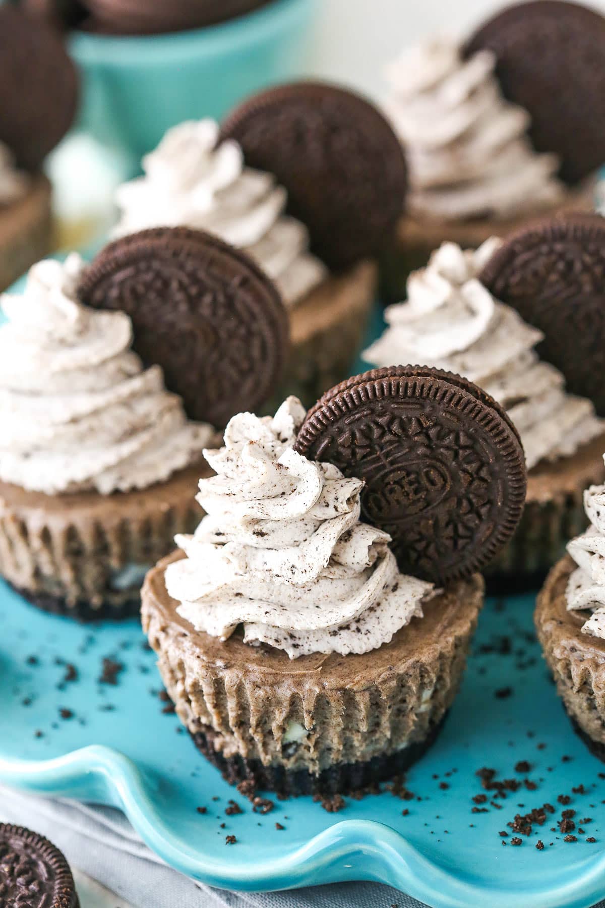 No bake mini Oreo cheesecakes on a serving platter.