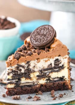 A slice of ultimate Oreo cheesecake on a plate.