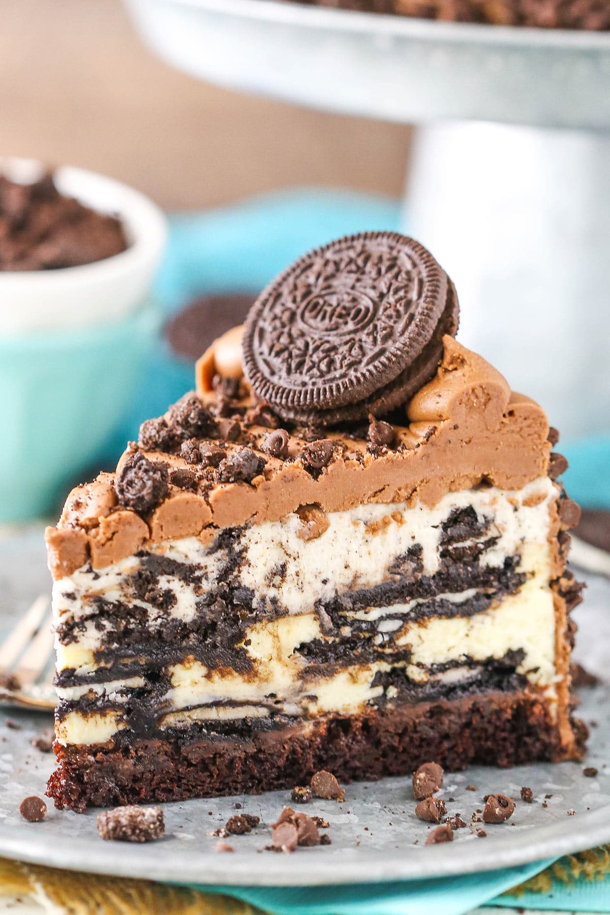 A slice of ultimate Oreo cheesecake on a plate.