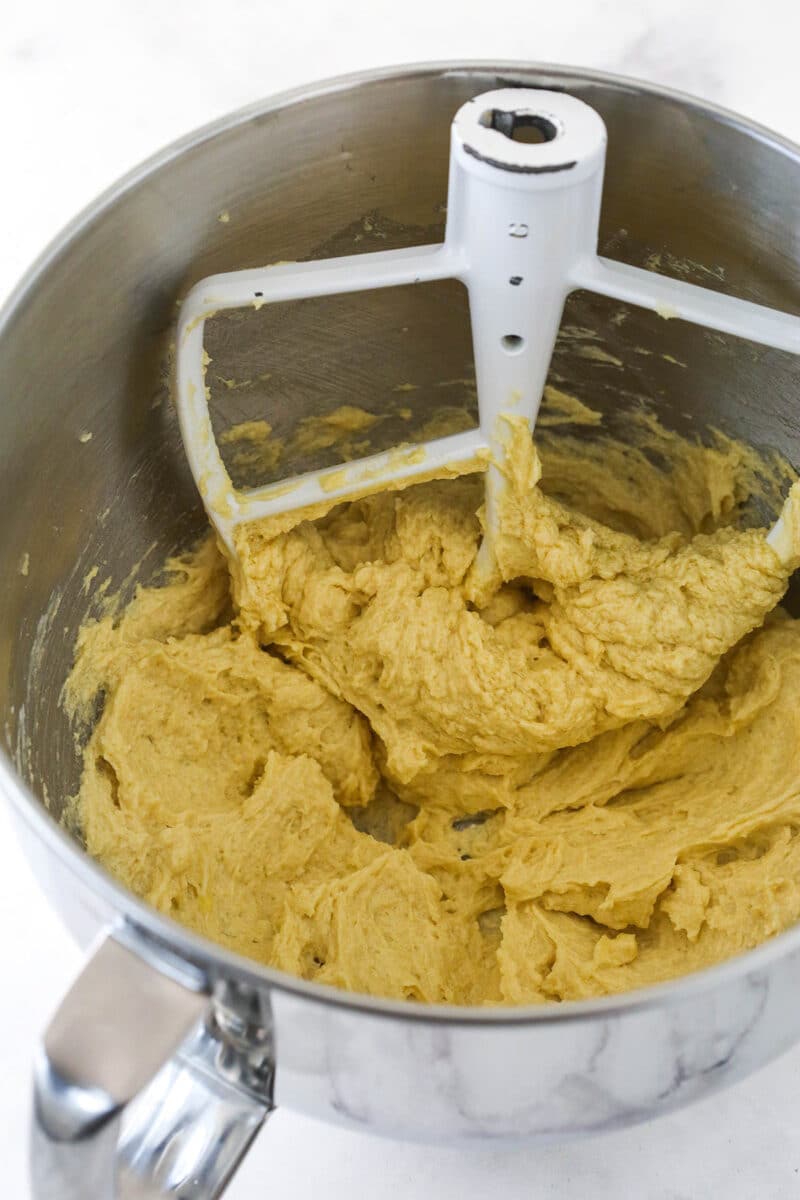 Mixing together wet ingredients for white chocolate chip cookies.