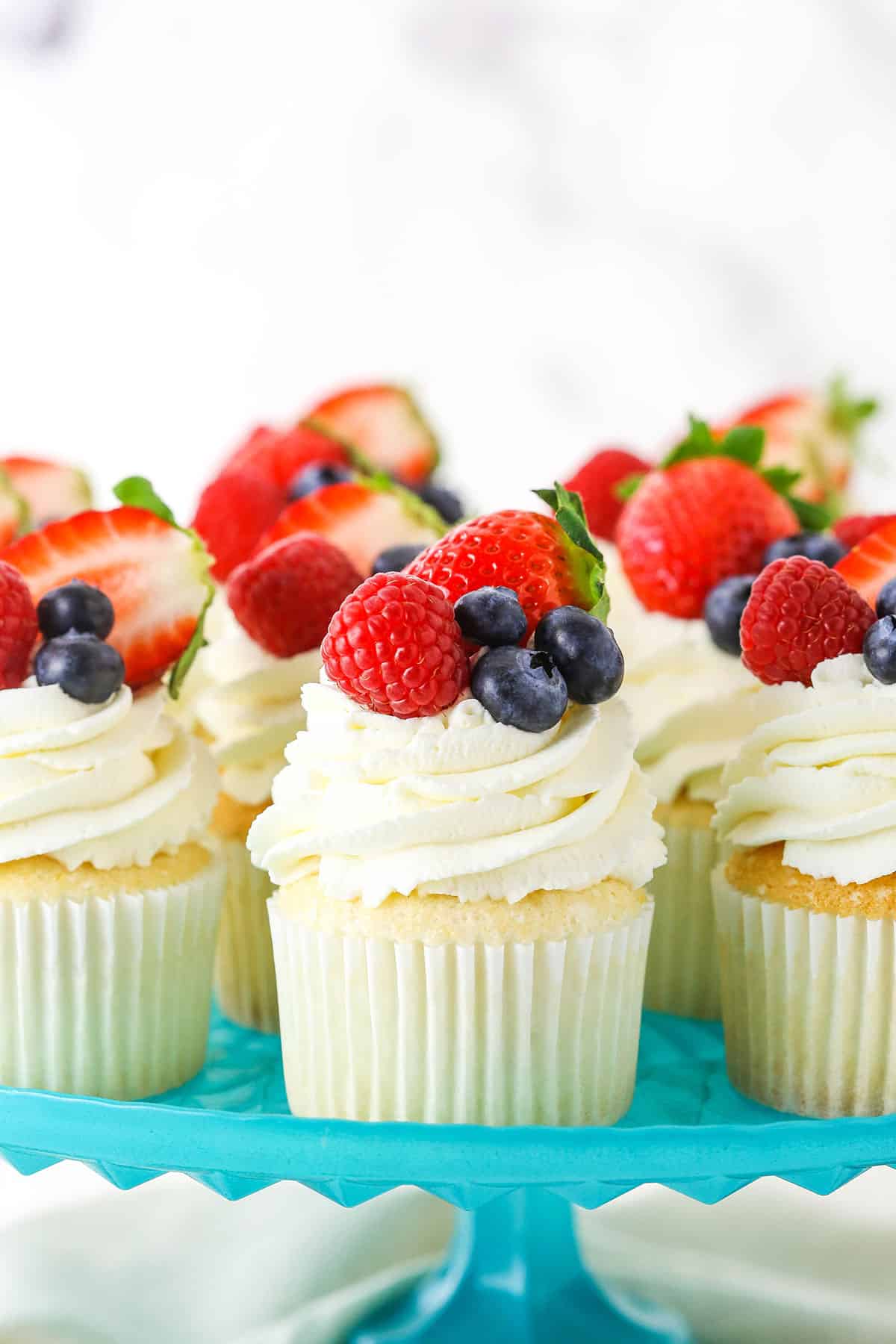 Fluffy Angel Food Cupcakes with Whipped Cream Frosting & Fresh Berries