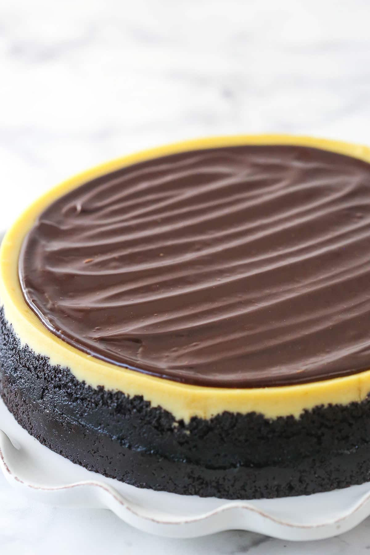 Baileys cheesecake topped with Baileys chocolate ganache.