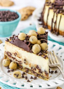 slice of chocolate chip cookie dough cheesecake on teal napkin